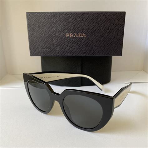 sunglasses prada womens color white and black|prada unisex glasses.